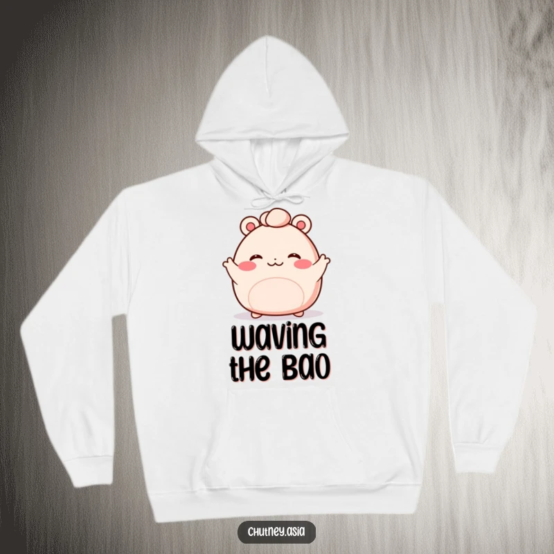 Funny bao bun hoodie showcasing a blushing, kawaii bao bun with tiny arms waving enthusiastically, offering warmth and cuteness.