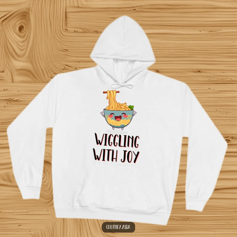 Funny ramen hoodie showcasing a cheerful, anthropomorphic bowl of ramen noodles wiggling excitedly, offering warmth and smiles.
